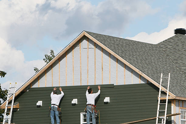 Professional Siding technician working in Summerfield, NC